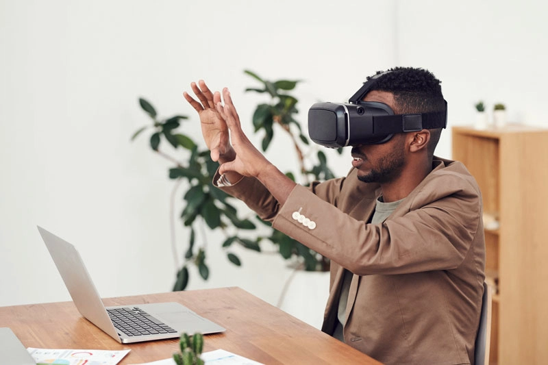 A man sitting in VR headset