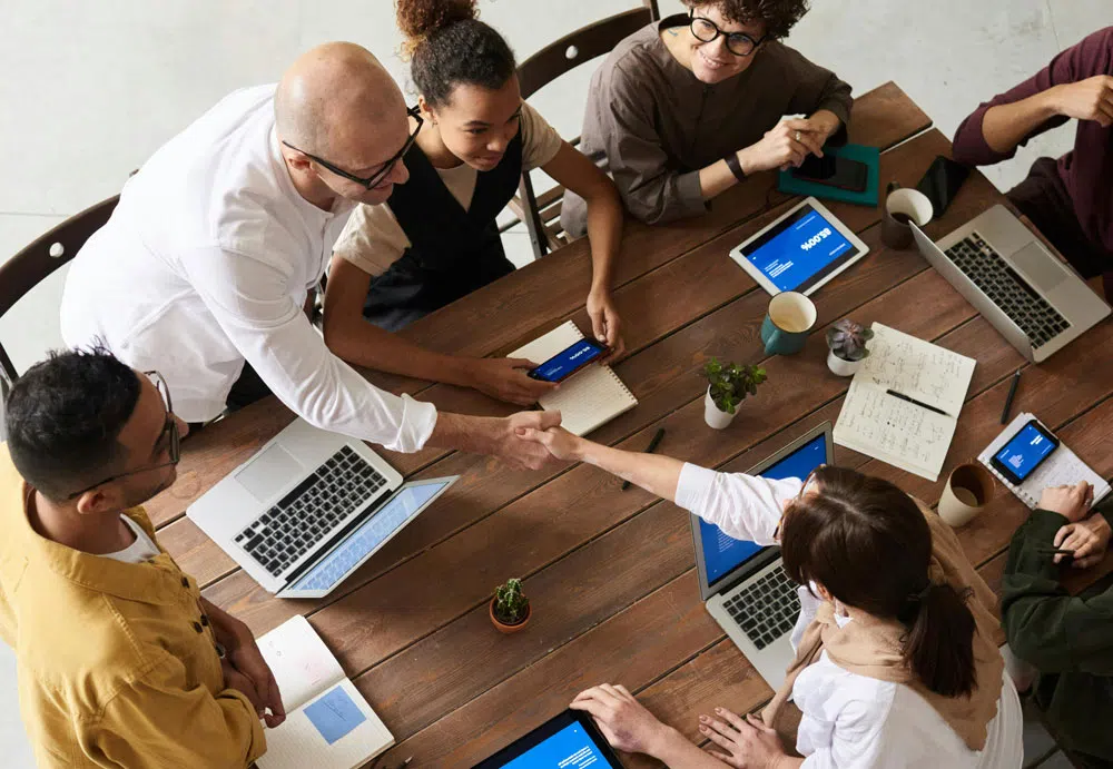 A group of people working at table