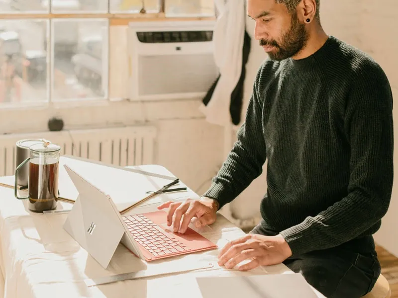 A man is working at a table