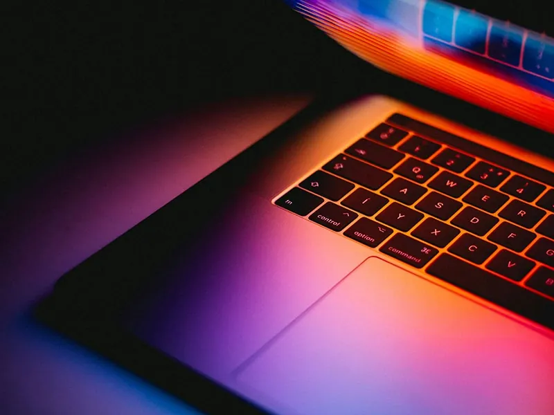 A laptop under glowing light